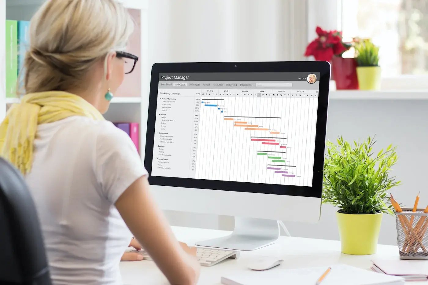 Woman looking at a Gantt chart